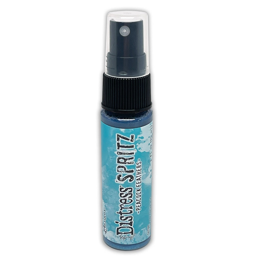 A 1oz bottle of Tim Holtz Distress Spritz with a peacock feathers color, designed for application on porous surfaces.
