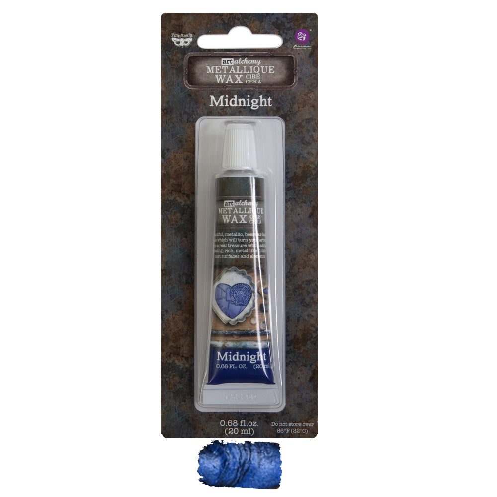 A tube of Finnabair Art Alchemy Metallique Wax in the shade 'Midnight', packaged in a card showing the product name and a swatch of the wax color.