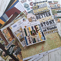 Collection of scrapbooking stickers with text and images on a wooden surface